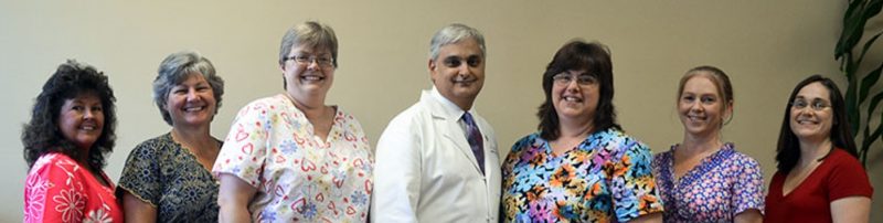 Dr. Mark Samia with the staff of Mas Medical Center